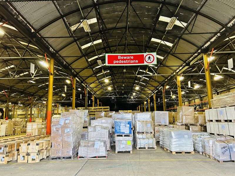 Warehouse pallets and pedestrian safety signage