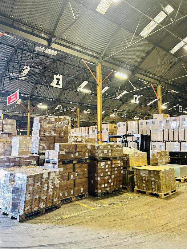 Warehouse stock organised by storage zones